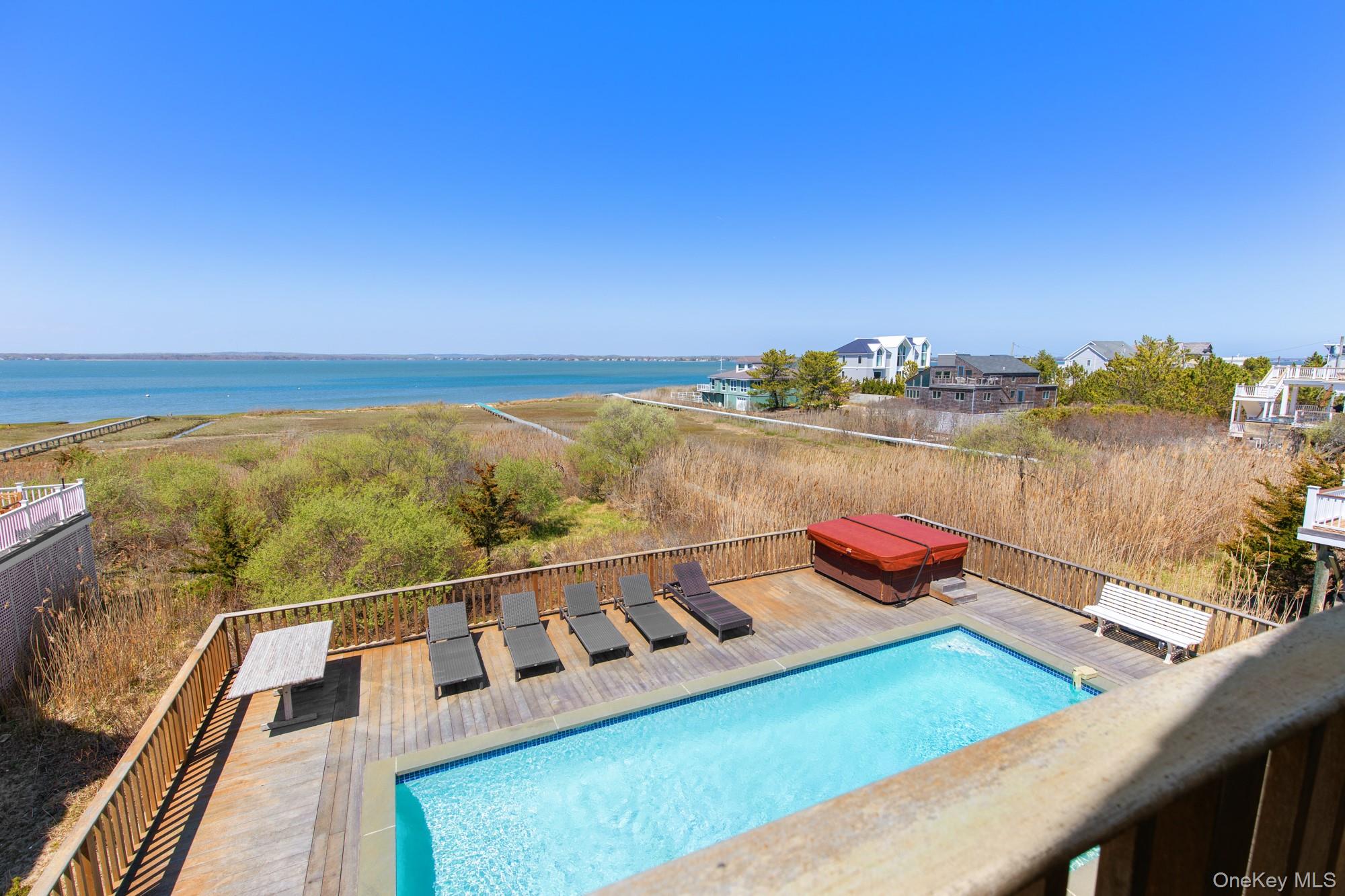 818 Dune Road Westhampton Beach, NY 11978 - Photo 30 of 30 a view of a balcony with an ocean view