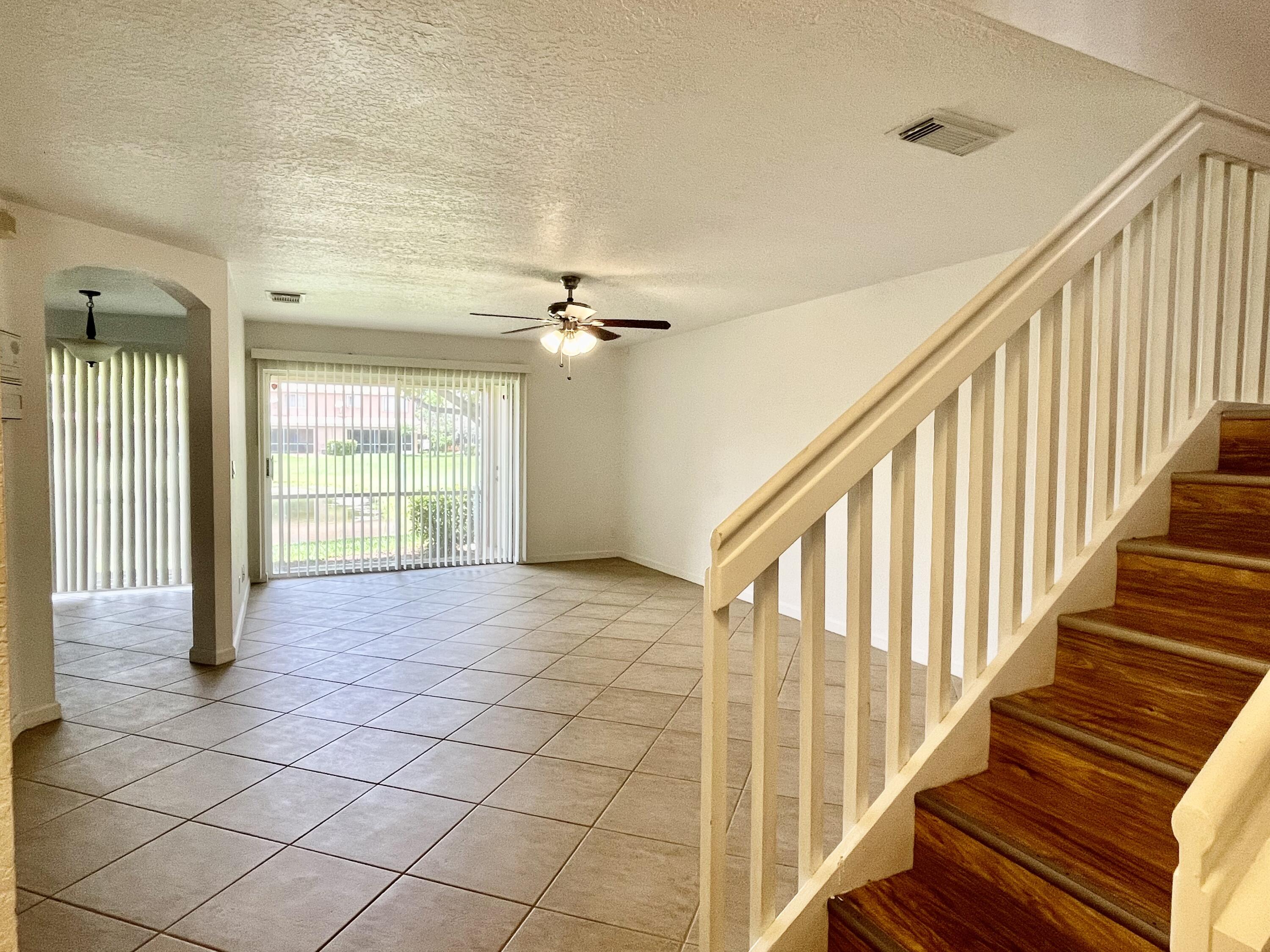 6204 Sandy Bank Terrace West Palm Beach, FL 33407 - Photo 11 of 37 a view of an entryway with wooden floor