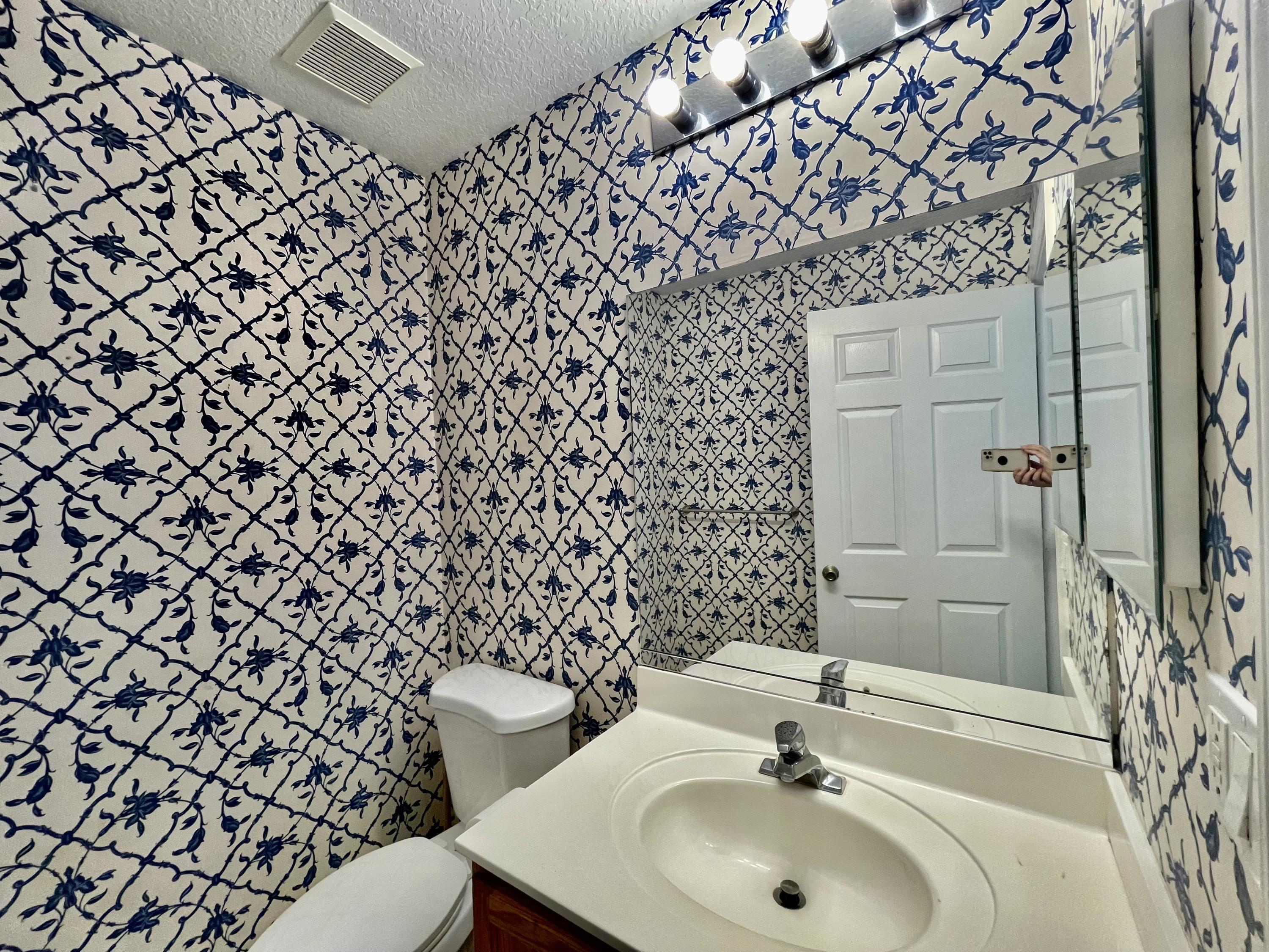 6204 Sandy Bank Terrace West Palm Beach, FL 33407 - Photo 12 of 37 a bathroom with a sink and a toilet