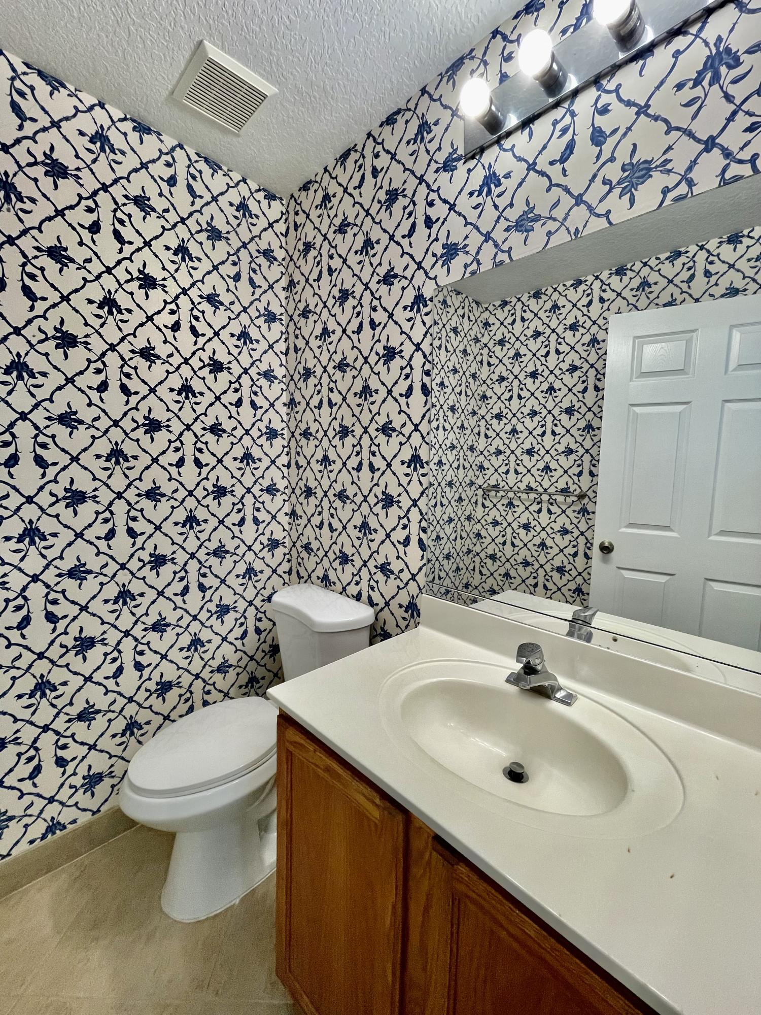 6204 Sandy Bank Terrace West Palm Beach, FL 33407 - Photo 13 of 37 a bathroom with a sink and a toilet