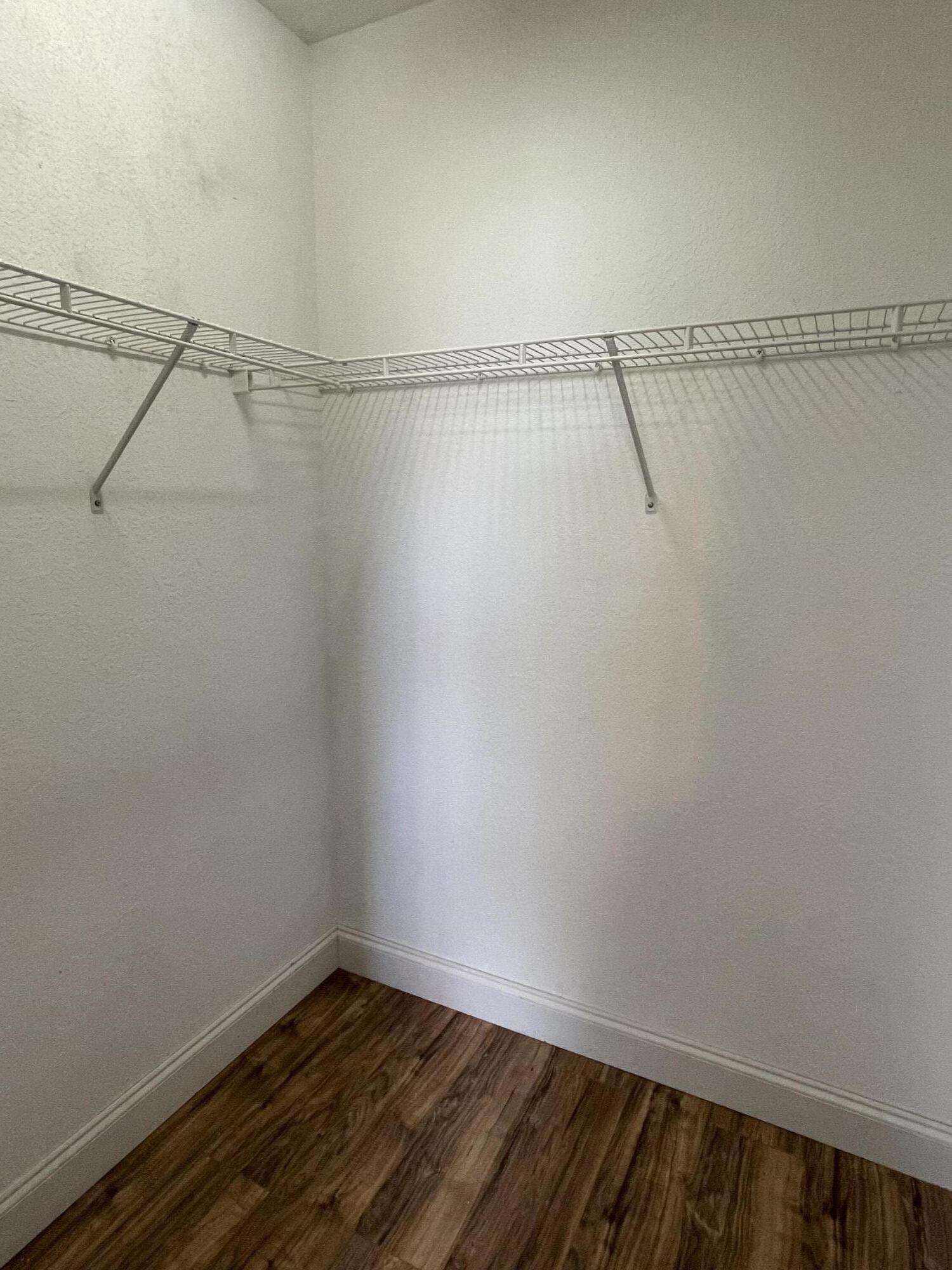 6204 Sandy Bank Terrace West Palm Beach, FL 33407 - Photo 18 of 37 a view of a room with racks on the wall