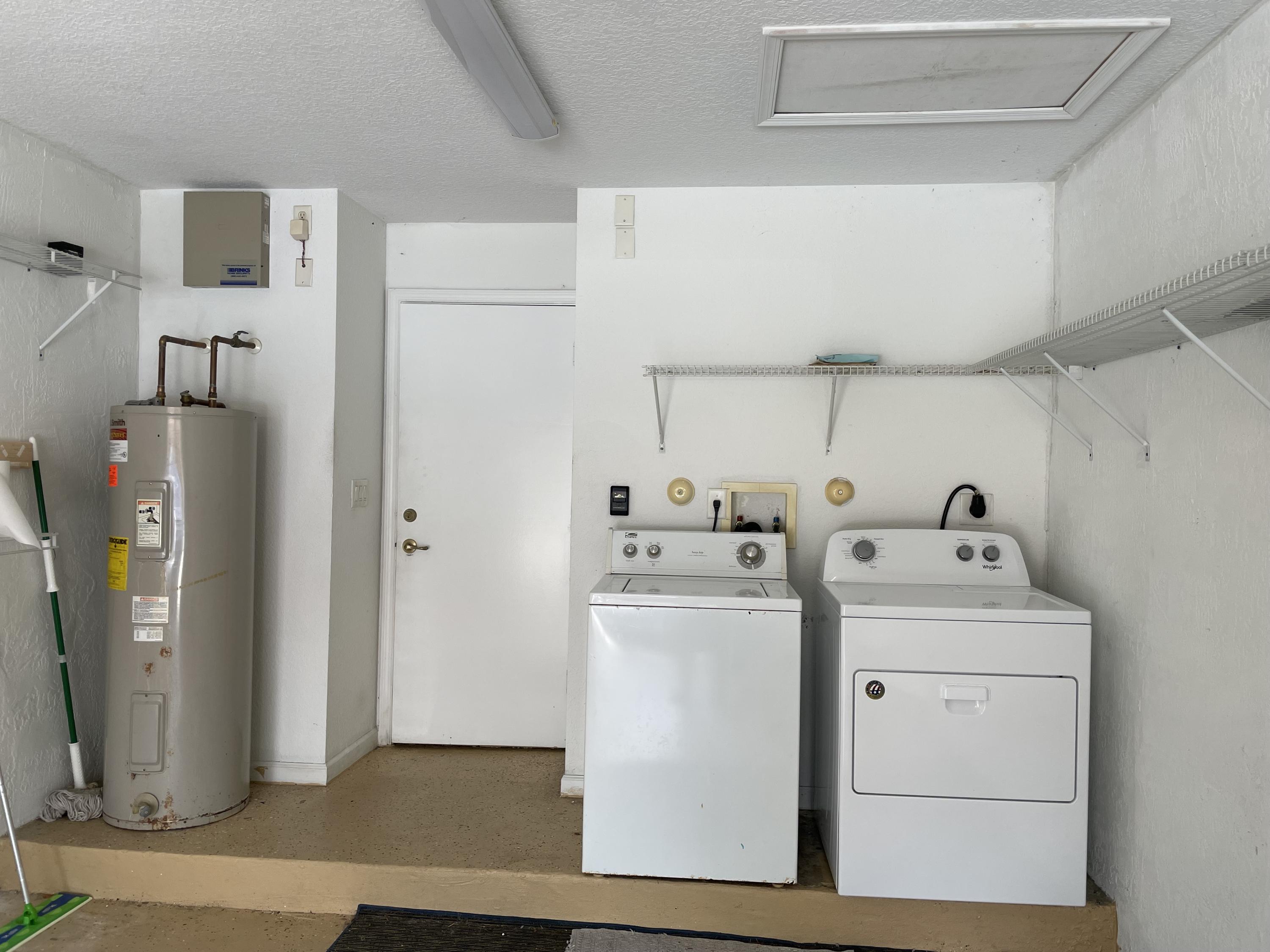 6204 Sandy Bank Terrace West Palm Beach, FL 33407 - Photo 21 of 37 a utility room with dryer and washer