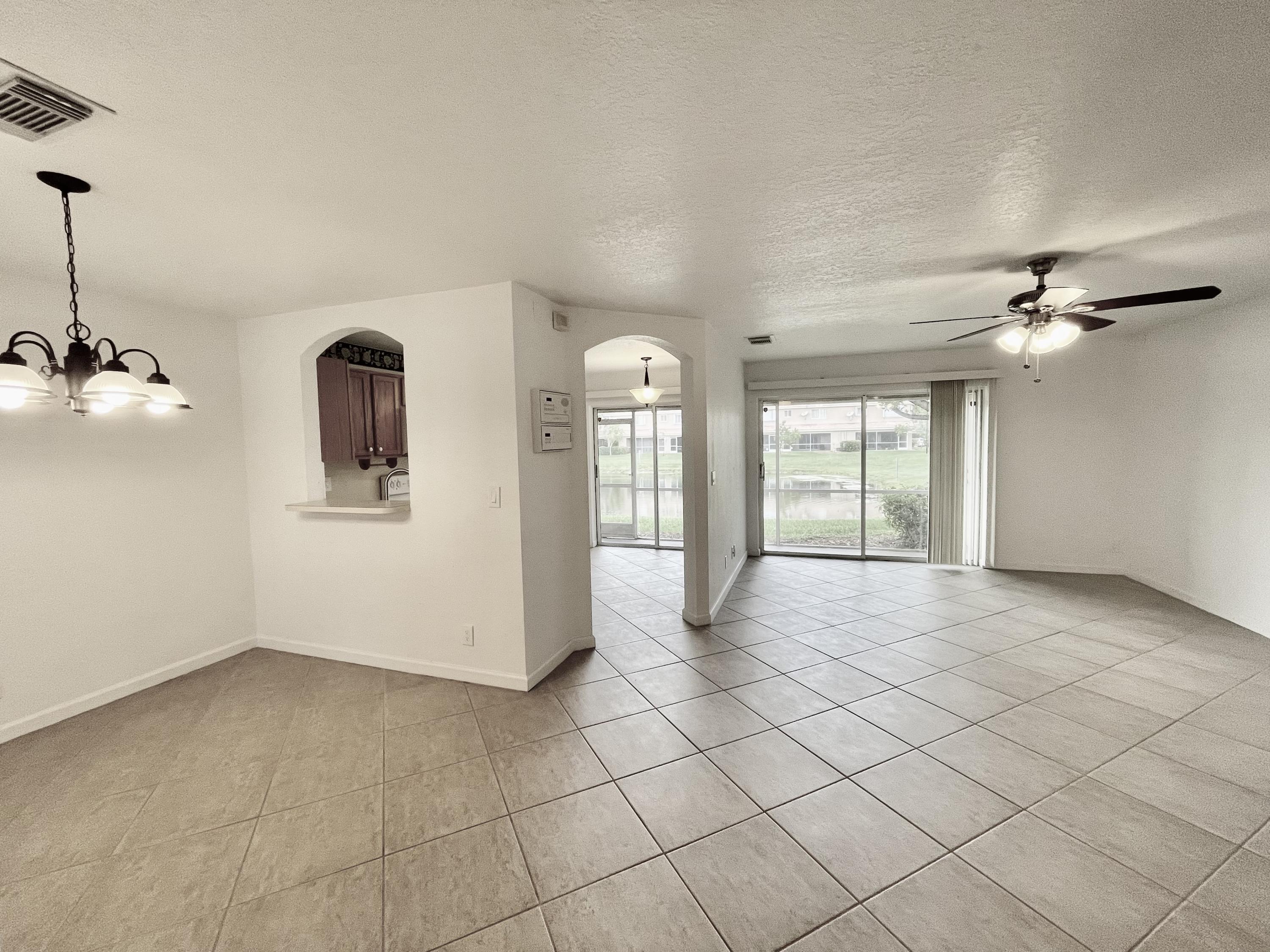 6204 Sandy Bank Terrace West Palm Beach, FL 33407 - Photo 3 of 37 a view of an empty room and window