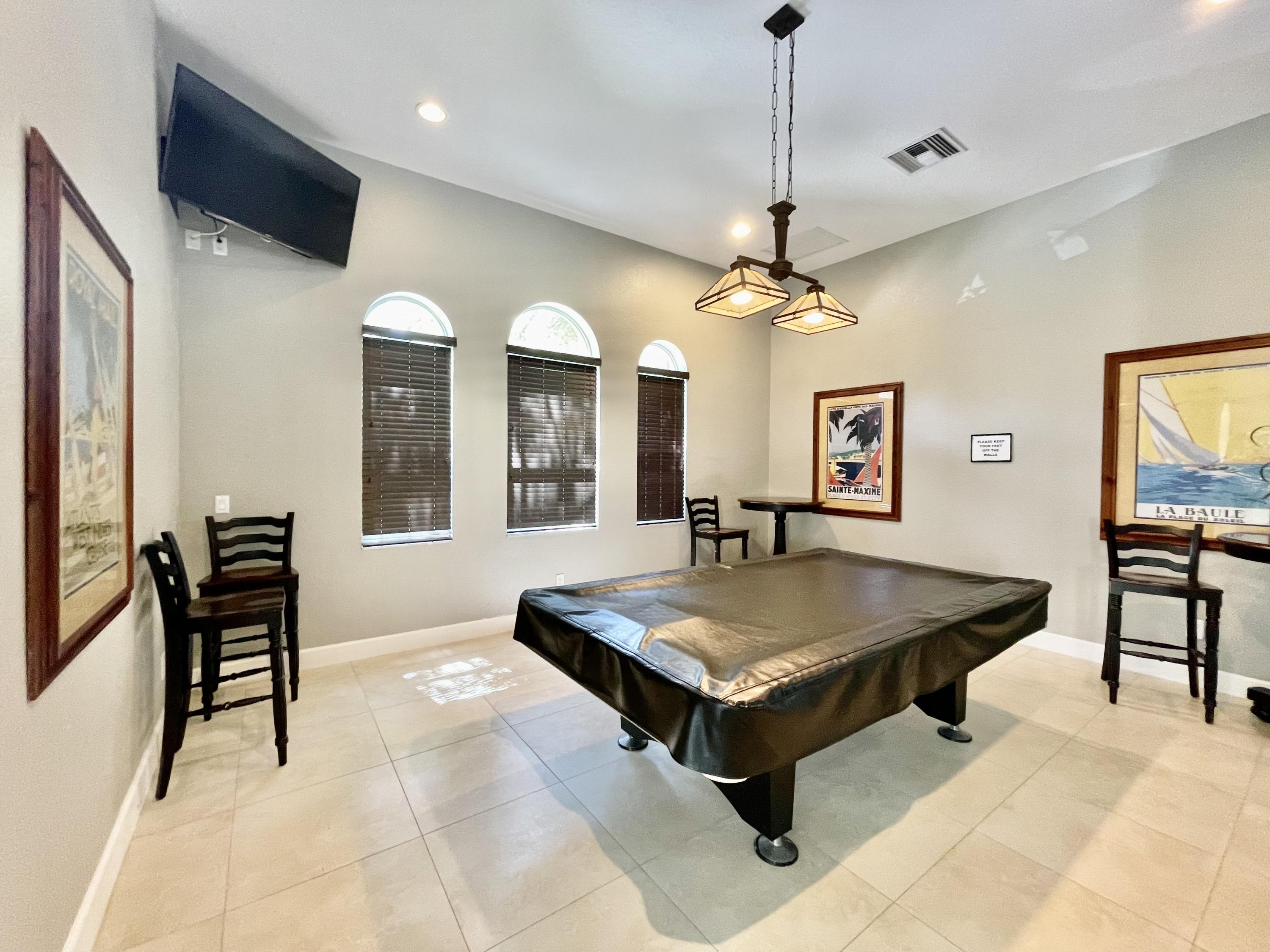 6204 Sandy Bank Terrace West Palm Beach, FL 33407 - Photo 31 of 37 a room with pool table and windows