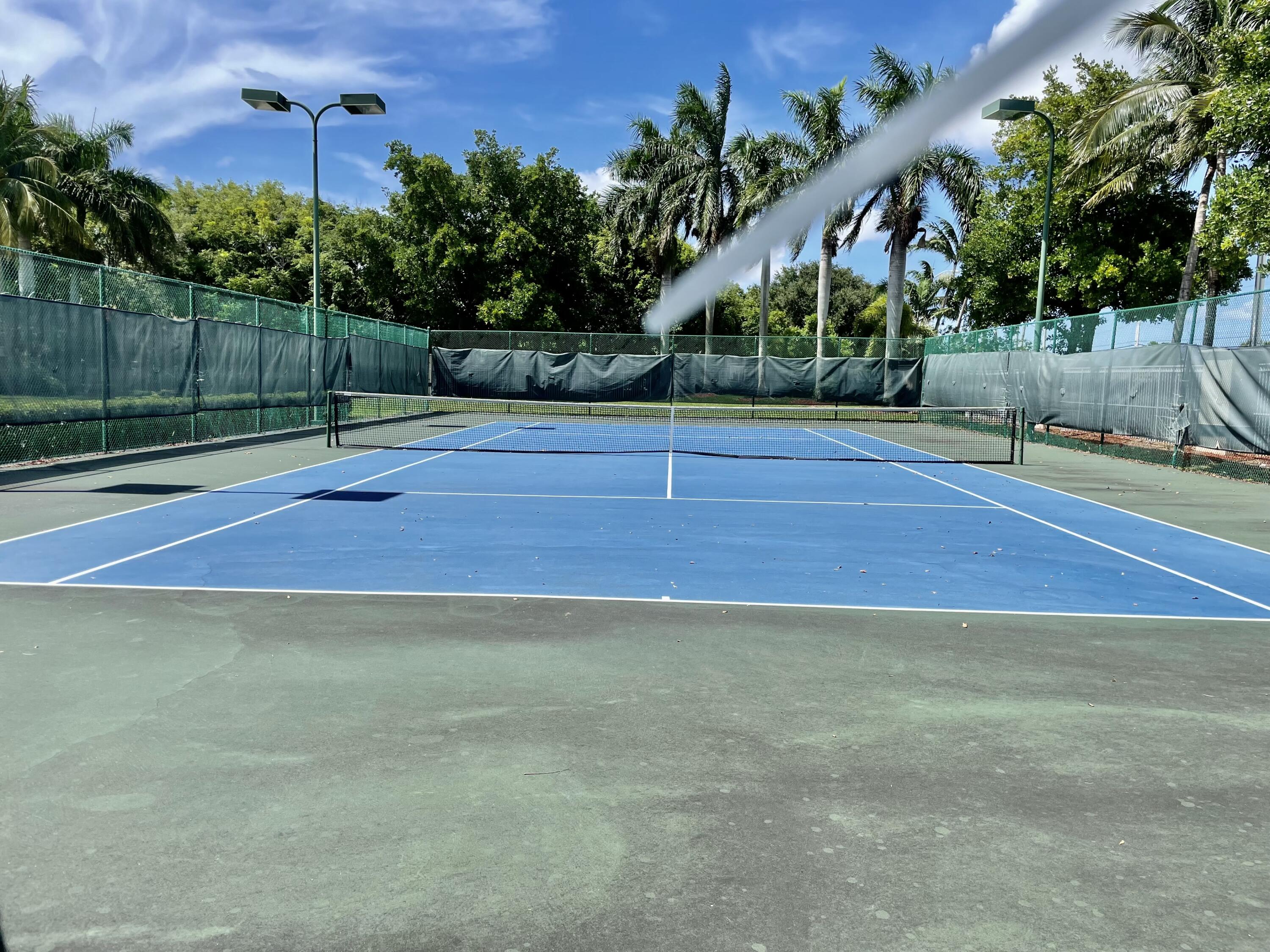 6204 Sandy Bank Terrace West Palm Beach, FL 33407 - Photo 33 of 37 a view of a tennis court
