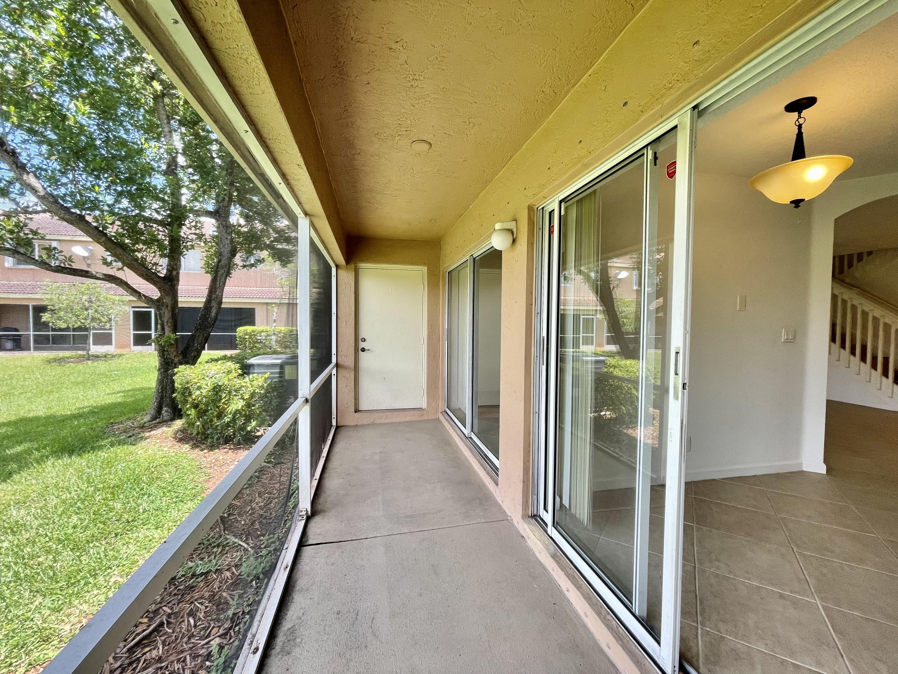 6204 Sandy Bank Terrace West Palm Beach, FL 33407 - Photo 9 of 37 a view of a house with a porch