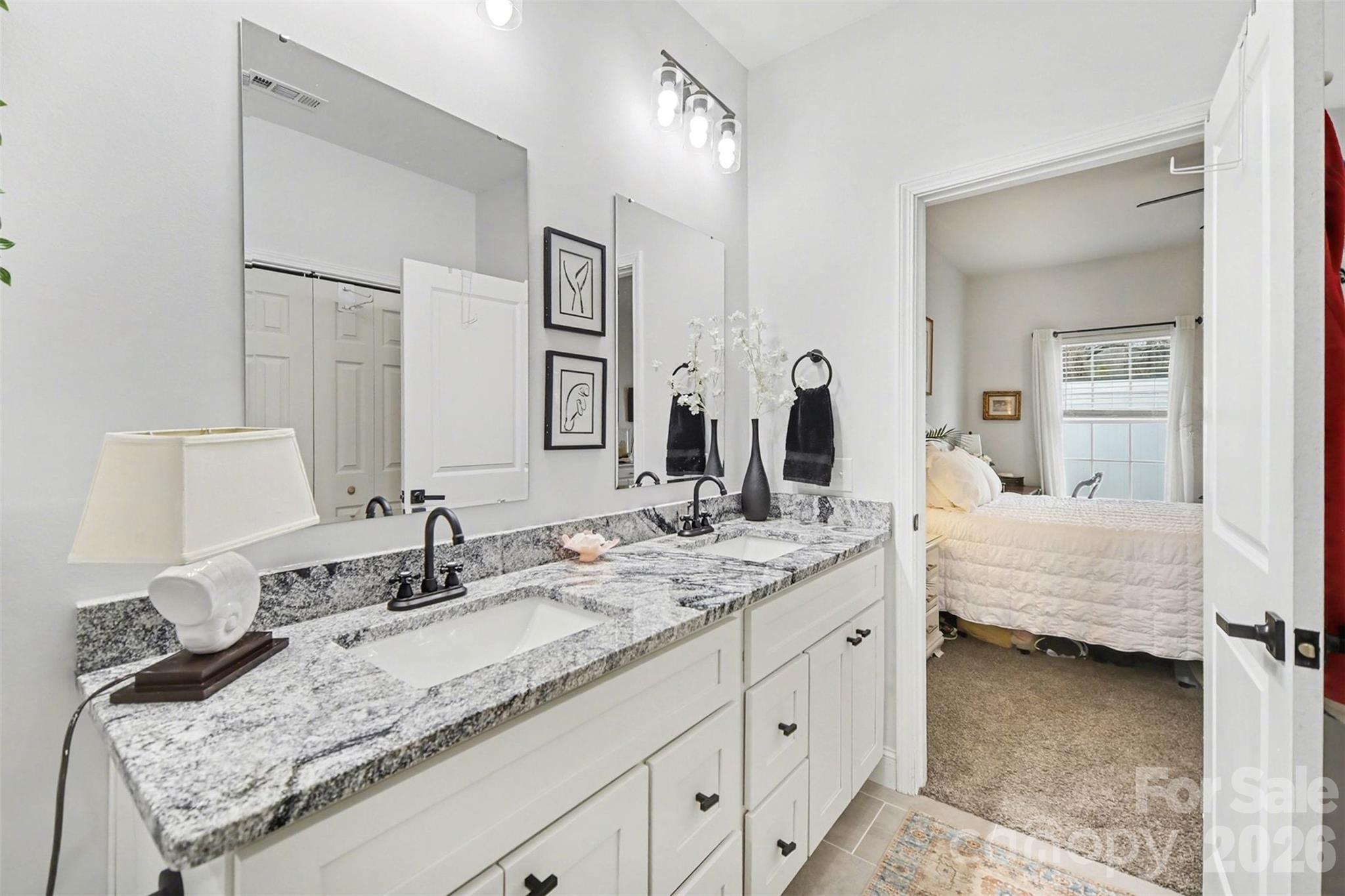 3236 Cottage Rose Lane Rock Hill, SC 29732 - Photo 18 of 27 a en suite bathroom with double sink and a mirror