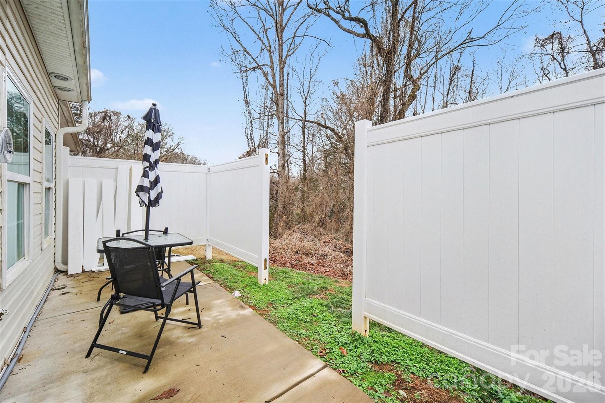 3236 Cottage Rose Lane Rock Hill, SC 29732 - Photo 24 of 27 a view of a patio with a table and chairs and potted plants