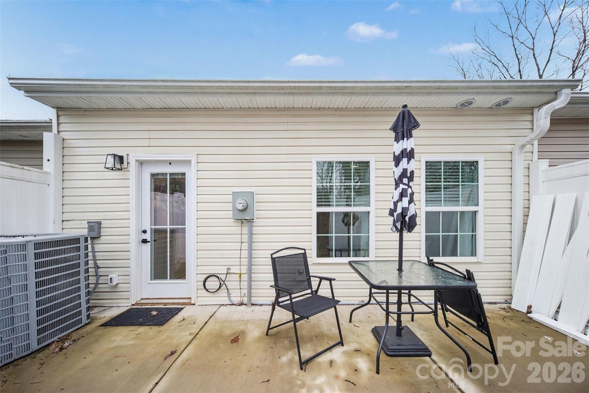 3236 Cottage Rose Lane Rock Hill, SC 29732 - Photo 25 of 27 a view of a patio with couple of chairs and potted plants