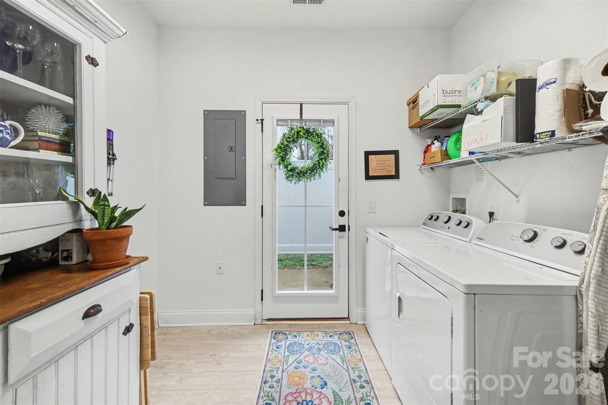 3236 Cottage Rose Lane Rock Hill, SC 29732 - Photo 9 of 27 a utility room with cabinets washer and dryer