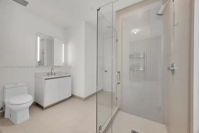 a room with a large window and a table