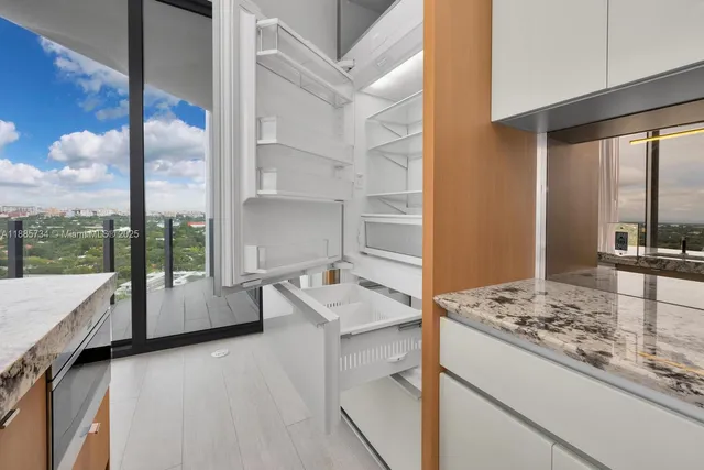 a stove top oven sitting inside of a kitchen