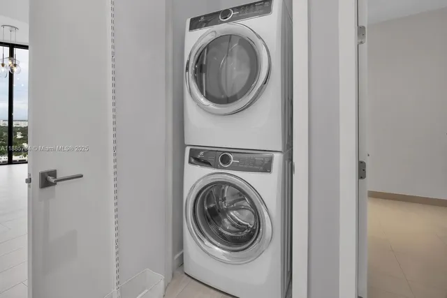 a view of kitchen with granite countertop a sink and a stove top oven