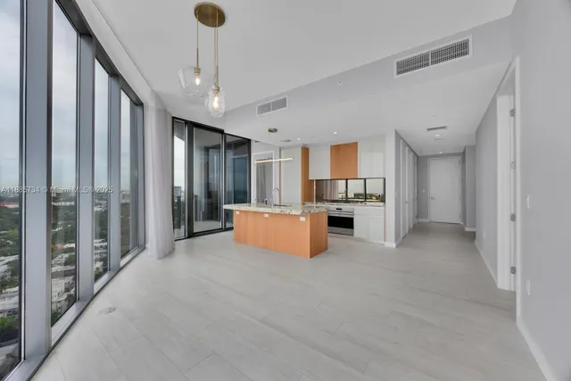 a living room with large windows