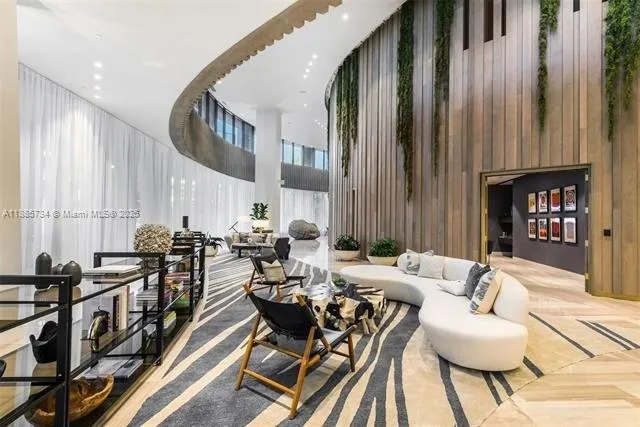 a living room with dining room and wooden floor