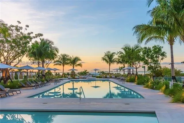 a view of a chairs and table in patio