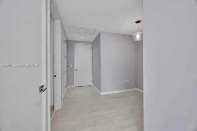 a view of a workspace with furniture and wooden floor