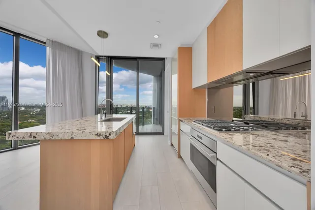 a view of a balcony with floor to ceiling windows yard and outdoor view