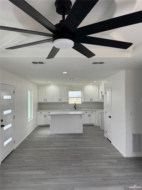 7513 Aztec Street Donna, TX 78537 - Photo 6 of 15 a large white kitchen with wooden floor