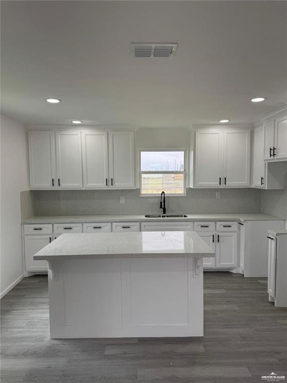 7513 Aztec Street Donna, TX 78537 - Photo 8 of 15 a kitchen with kitchen island sink stove and cabinets
