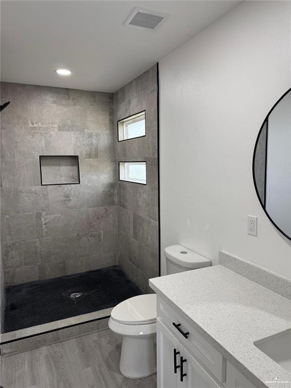 7513 Aztec Street Donna, TX 78537 - Photo 10 of 15 a bathroom with a sink a toilet and shower