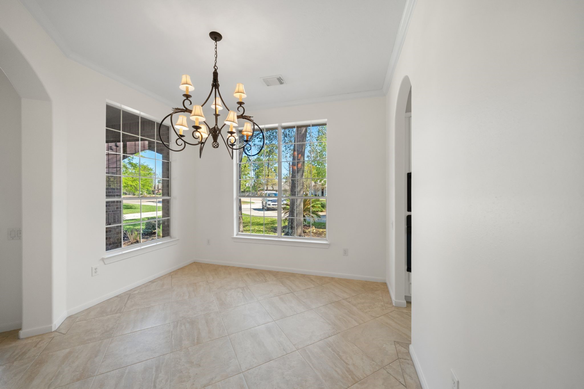7 Sovereign Way Conroe, TX 77384 - Photo 9 of 31 a view of a room with windows and chandelier