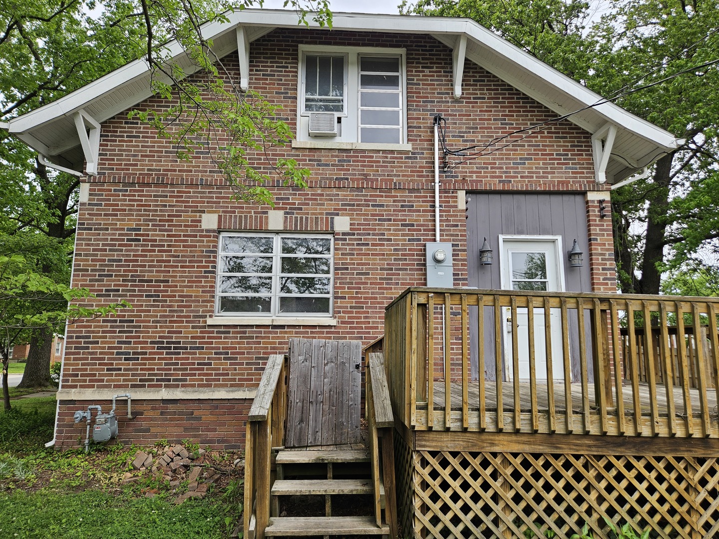 402 East 5th Street Flora, IL 62839 - Photo 4 of 29 a brick house with large windows