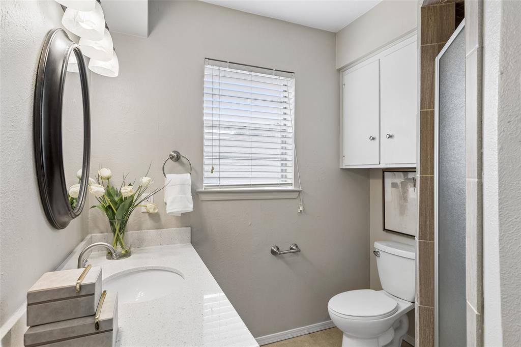 4962 Thunder Road Dallas, TX 75244 - Photo 20 of 26 The primary bath features quartz countertops and a shower.