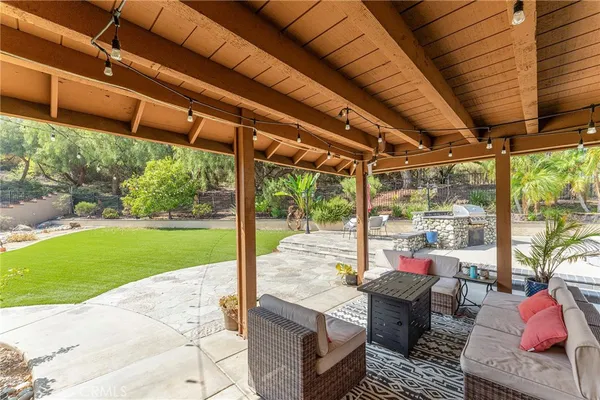 a building outdoor space with patio furniture and garden