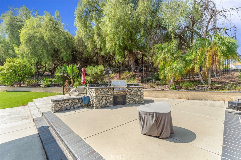 15 Ravencrest Circle Phillips Ranch, CA 91766 - Photo 19 of 22 a view of a swimming pool with a patio