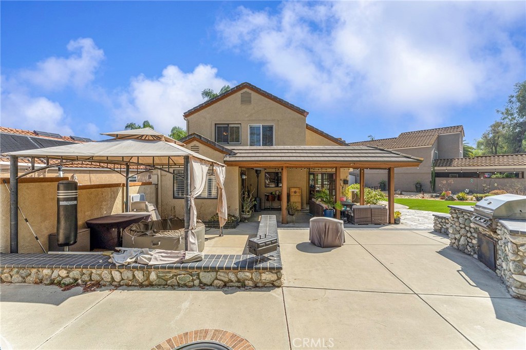 15 Ravencrest Circle Phillips Ranch, CA 91766 - Photo 20 of 22 a front view of a house with swimming pool and furniture