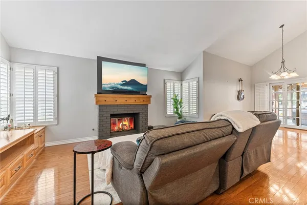 a bedroom with furniture and a fireplace