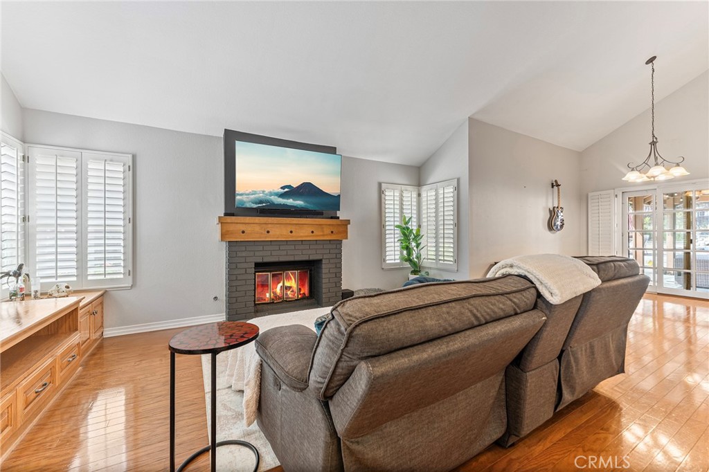 15 Ravencrest Circle Phillips Ranch, CA 91766 - Photo 2 of 22 a bedroom with furniture and a fireplace