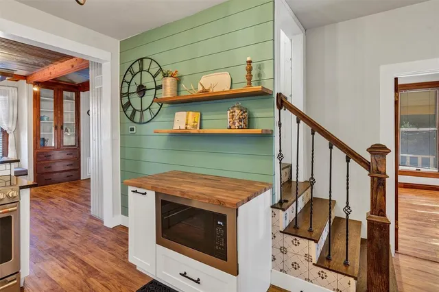 a view of an entryway with wooden floor