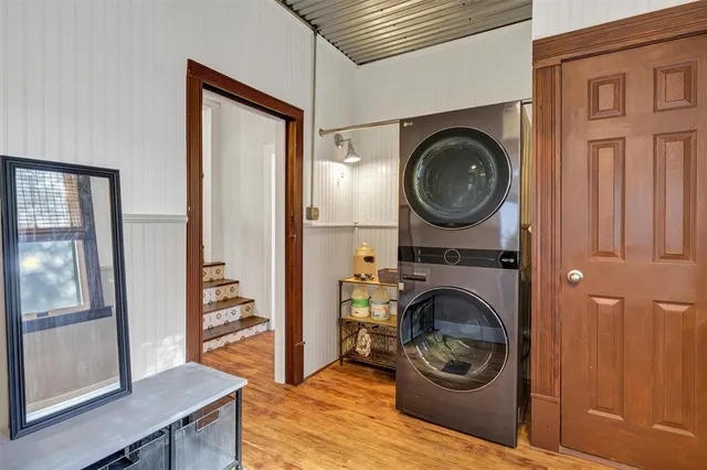 a view of a hallway with washer and dryer