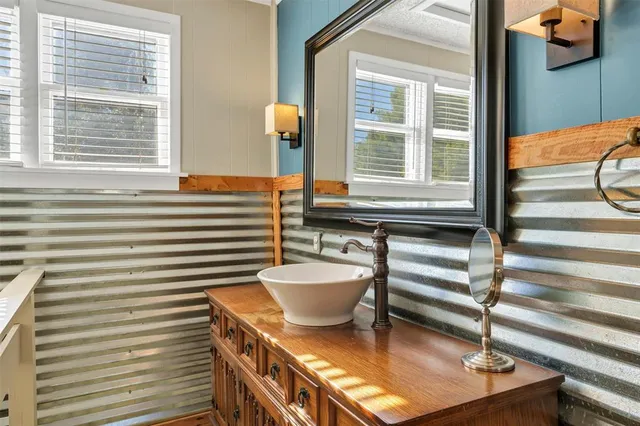 a bathroom with a sink and a mirror