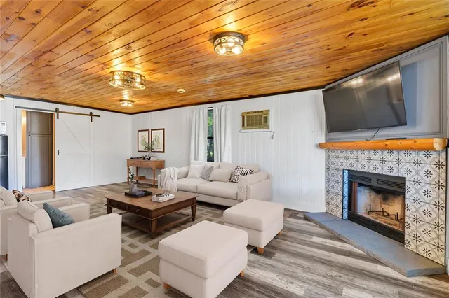 a living room with couches and a fireplace