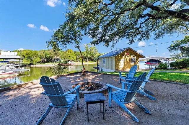 a view of a lounge chairs with a backyard