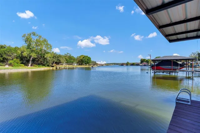 a view of an chairs and table in a patio