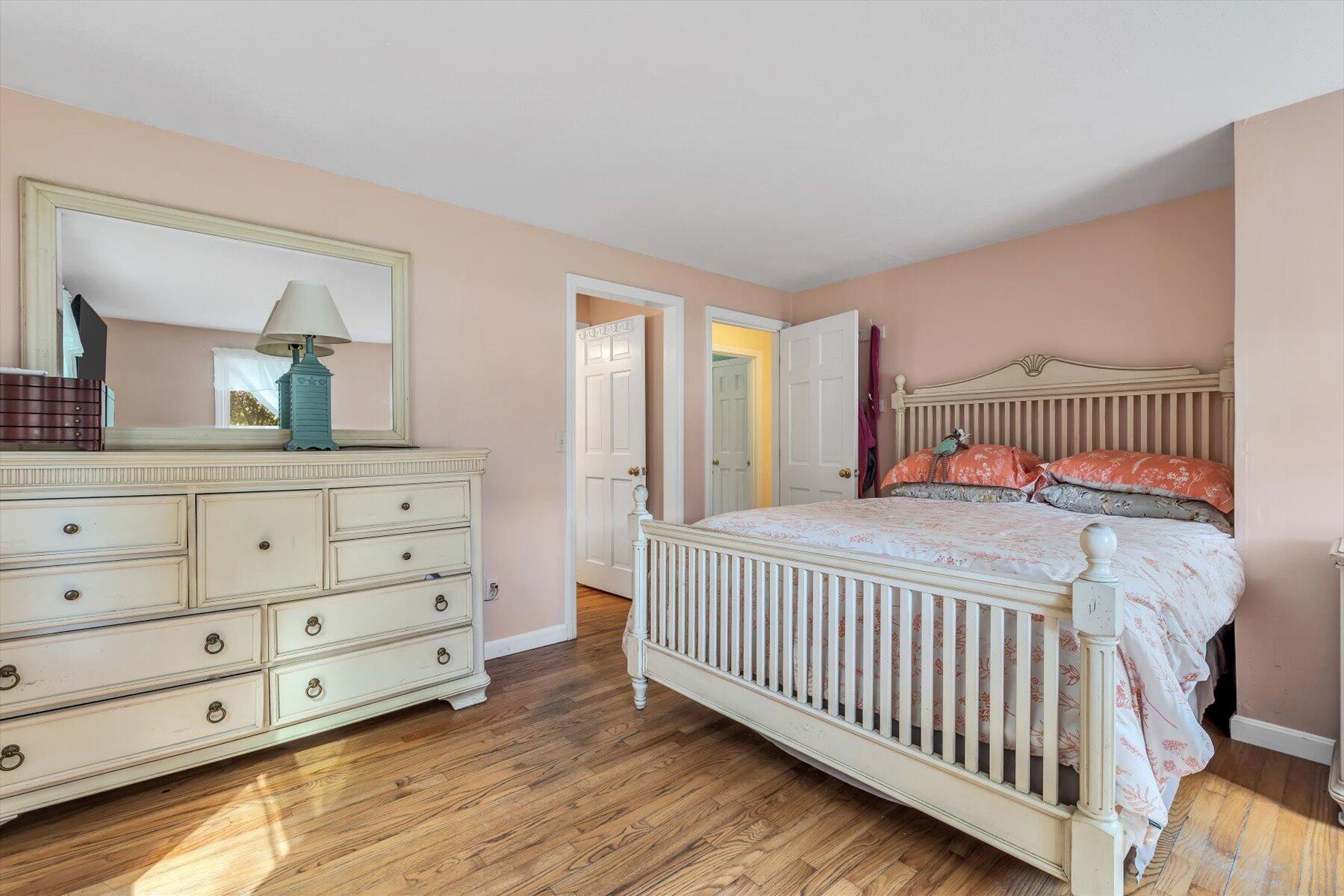 80 Curlew Way Cotuit, MA 02635 - Photo 16 of 37 a bedroom with a bed and a dresser