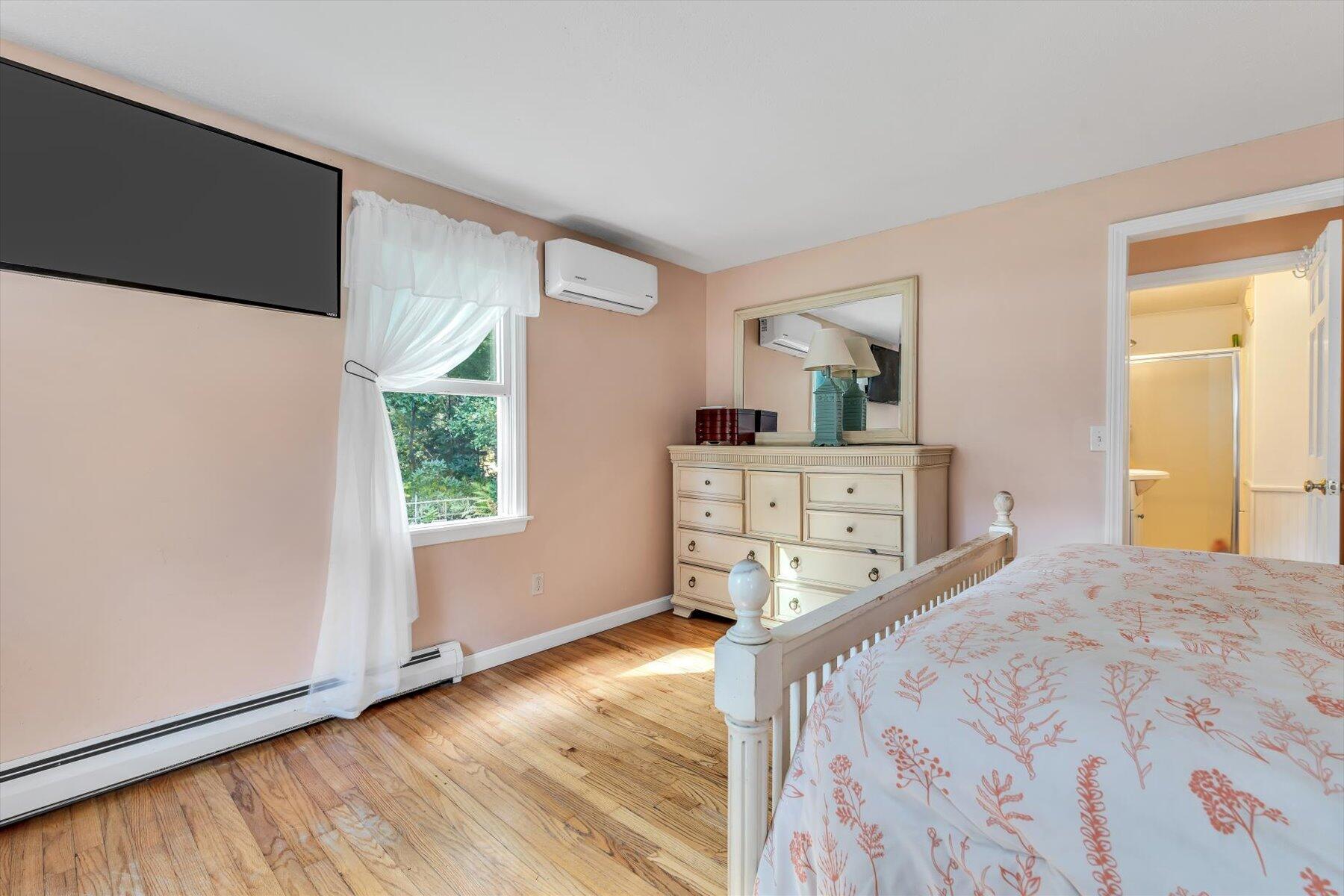 80 Curlew Way Cotuit, MA 02635 - Photo 19 of 37 a bedroom with a bed and a dresser