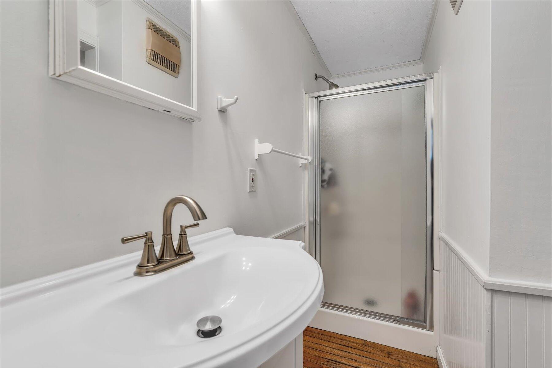 80 Curlew Way Cotuit, MA 02635 - Photo 20 of 37 a bathroom with a sink a mirror and shower