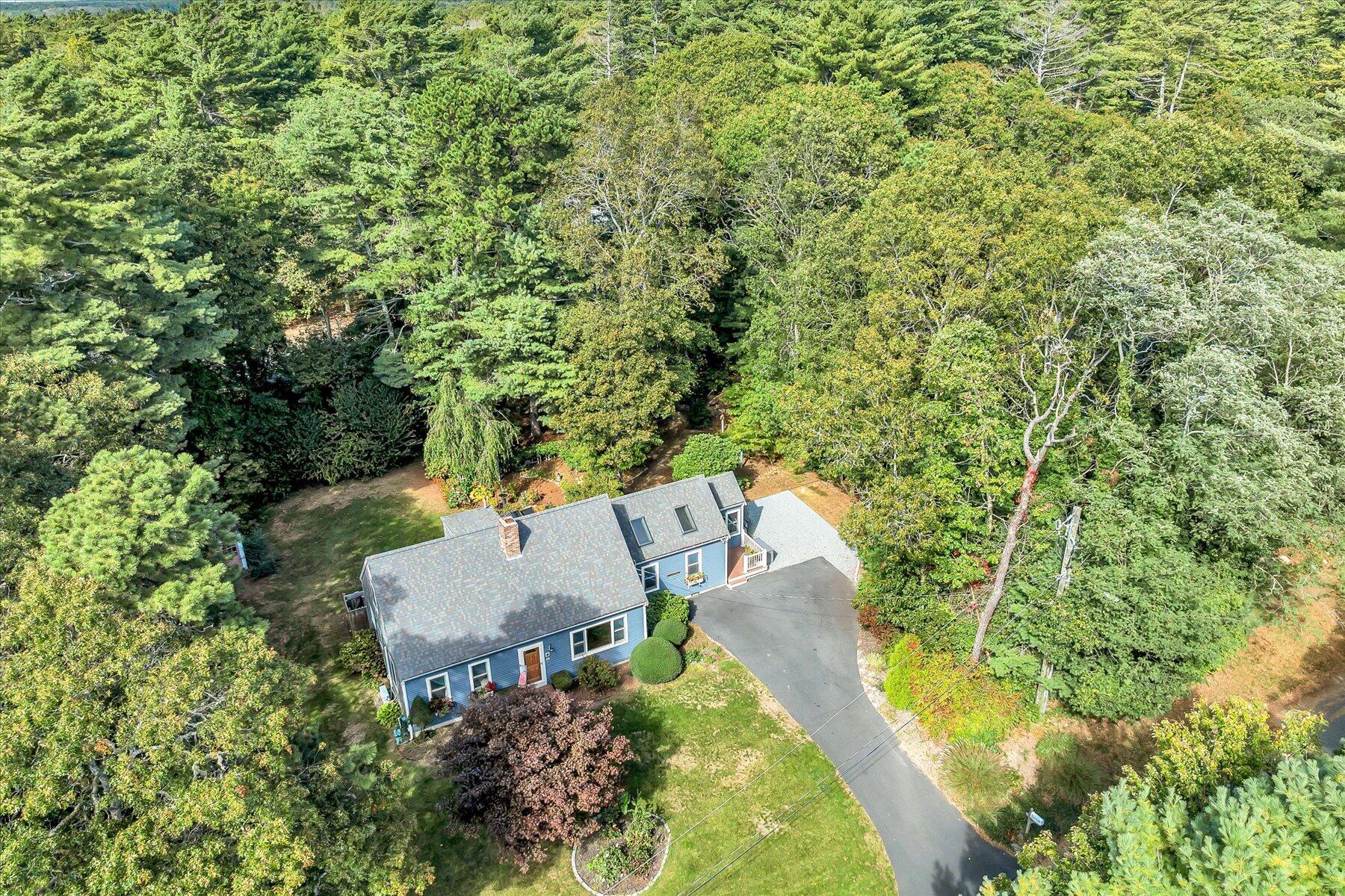 80 Curlew Way Cotuit, MA 02635 - Photo 3 of 37 an aerial view of residential house with outdoor space and trees all around