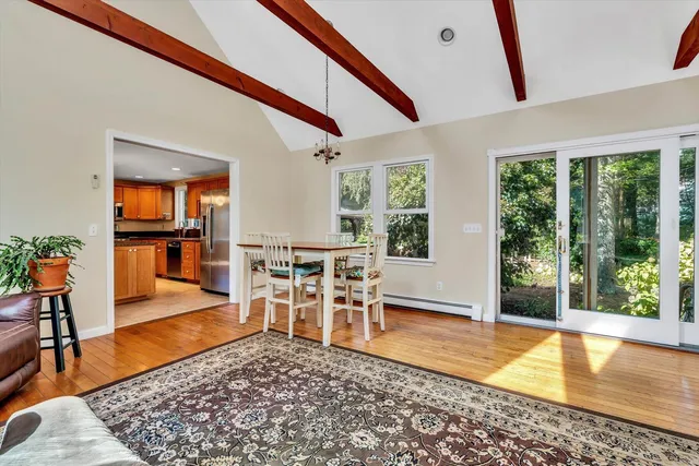 a living room with furniture a window and a table