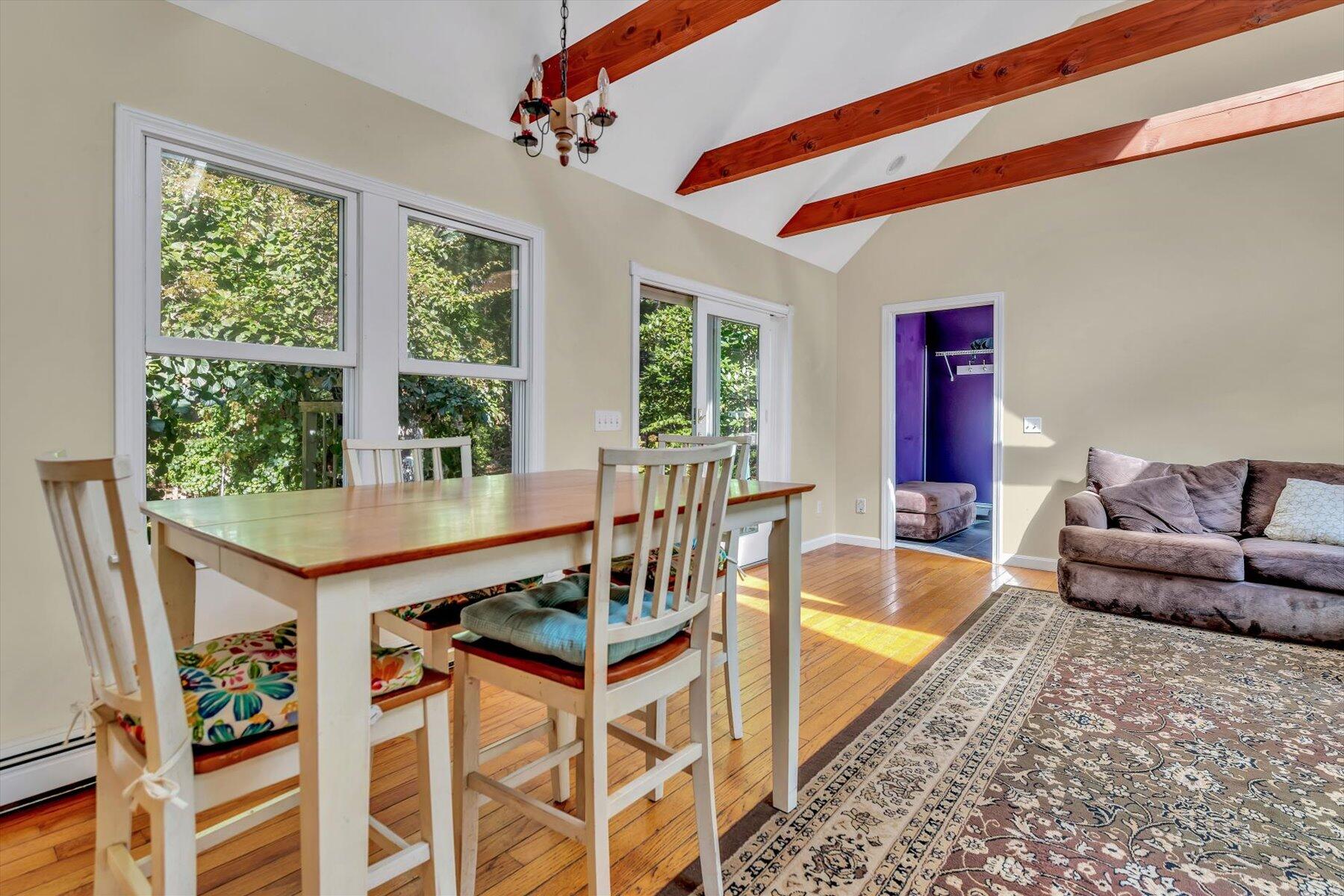 80 Curlew Way Cotuit, MA 02635 - Photo 6 of 37 a living room with furniture a flat screen tv and a large window