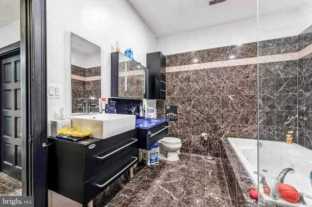 a view of a patio with table and chairs and potted plants