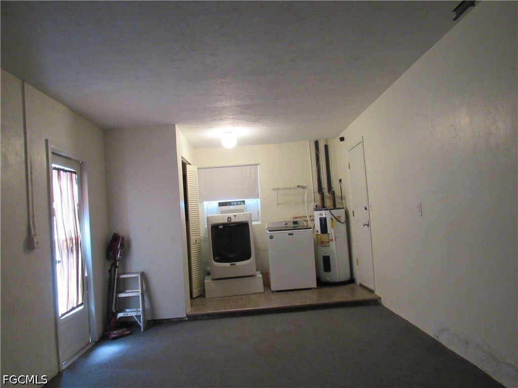 2976 Ribbon Court Fort Myers, FL 33905 - Photo 15 of 16 a view of a storage & utility room with washer and dryer