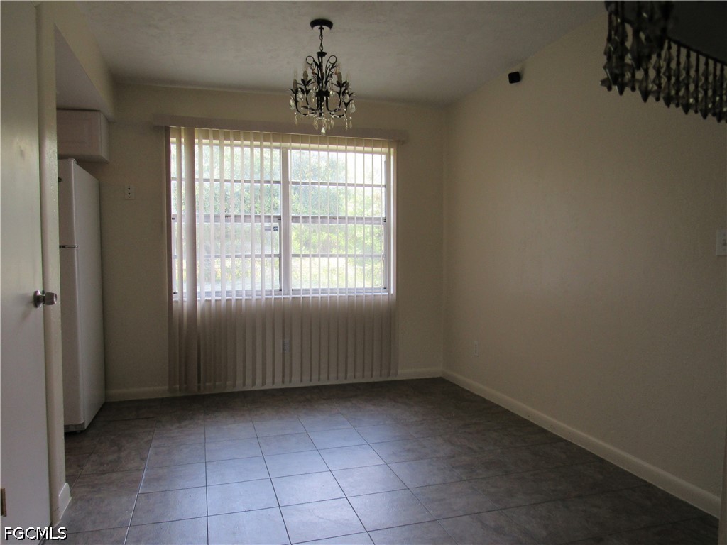2976 Ribbon Court Fort Myers, FL 33905 - Photo 8 of 16 a view of an empty room with a window