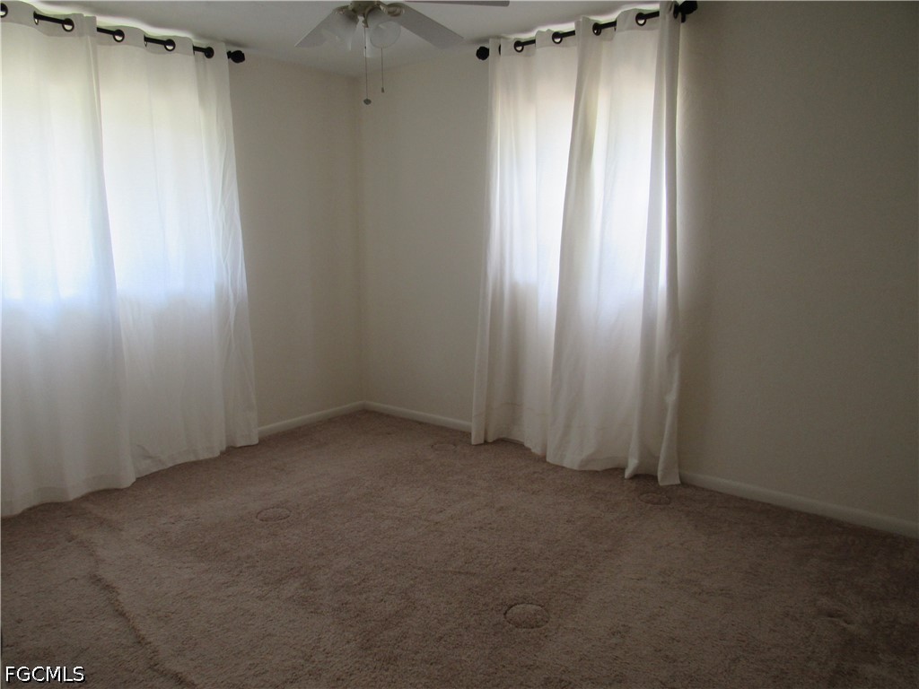 2976 Ribbon Court Fort Myers, FL 33905 - Photo 10 of 16 an empty room with windows