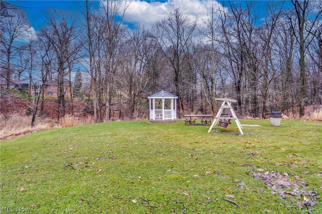View of green lawn with a gazebo